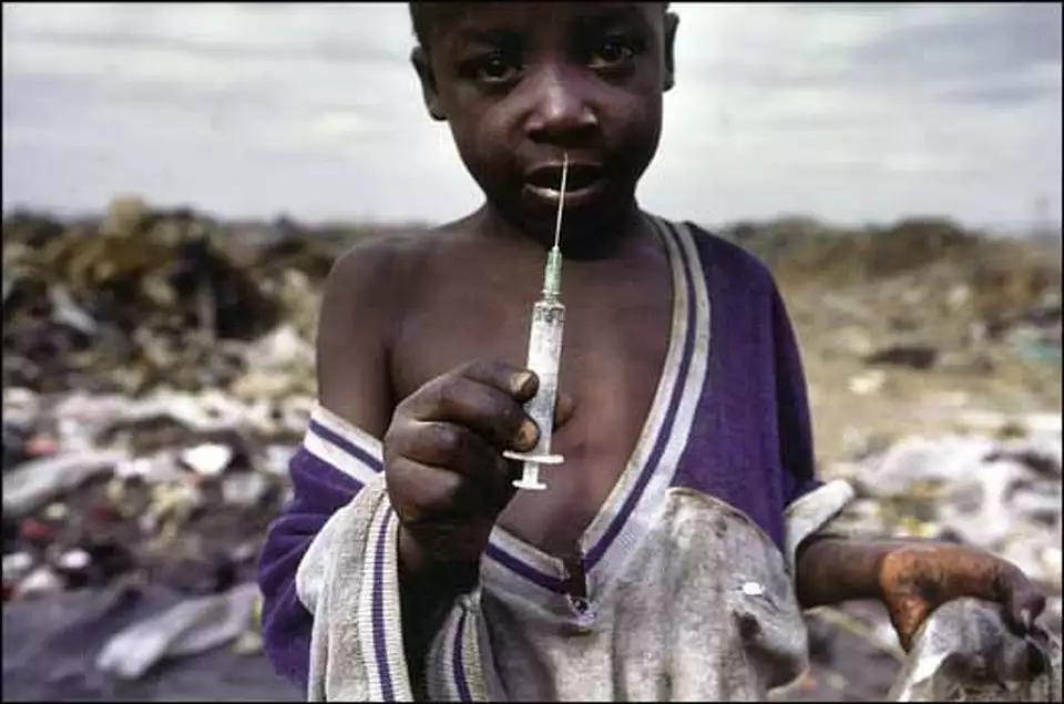 NEEDLES 2/C/18AUG98/MN/RM--In the slums of Nairobi a young boy earns a living by scavenging in the dump site of Dandora Estate, May1996. PHOTO BY ROBERT MALETTA/FOR THE CHRONICLE